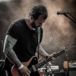 Jonas Wahlgren playing guitar at Dunk! 2022